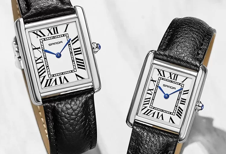 a pair of watches with leather straps