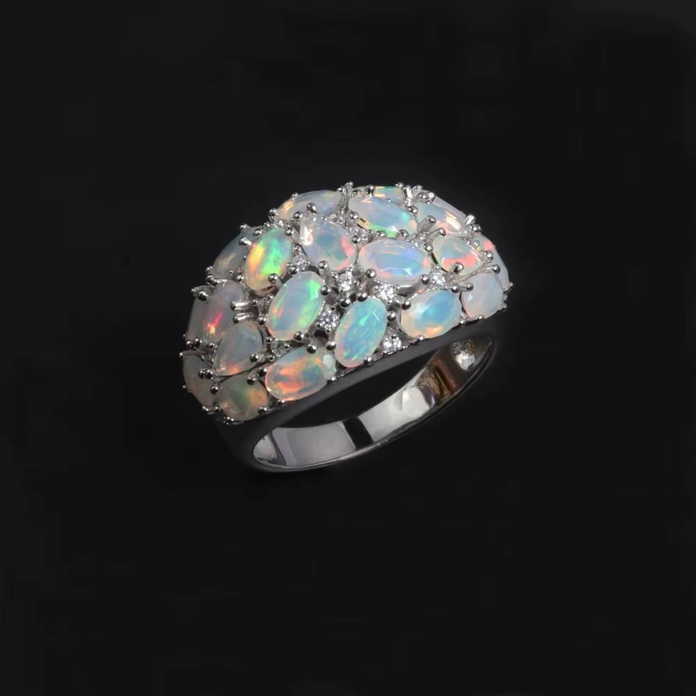 Luxury silver opal ring on black background