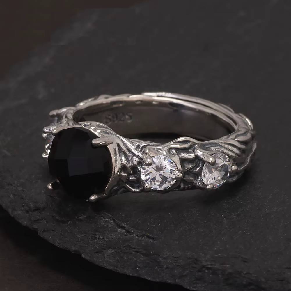 Gothic silver ring with black onyx and clear side stones