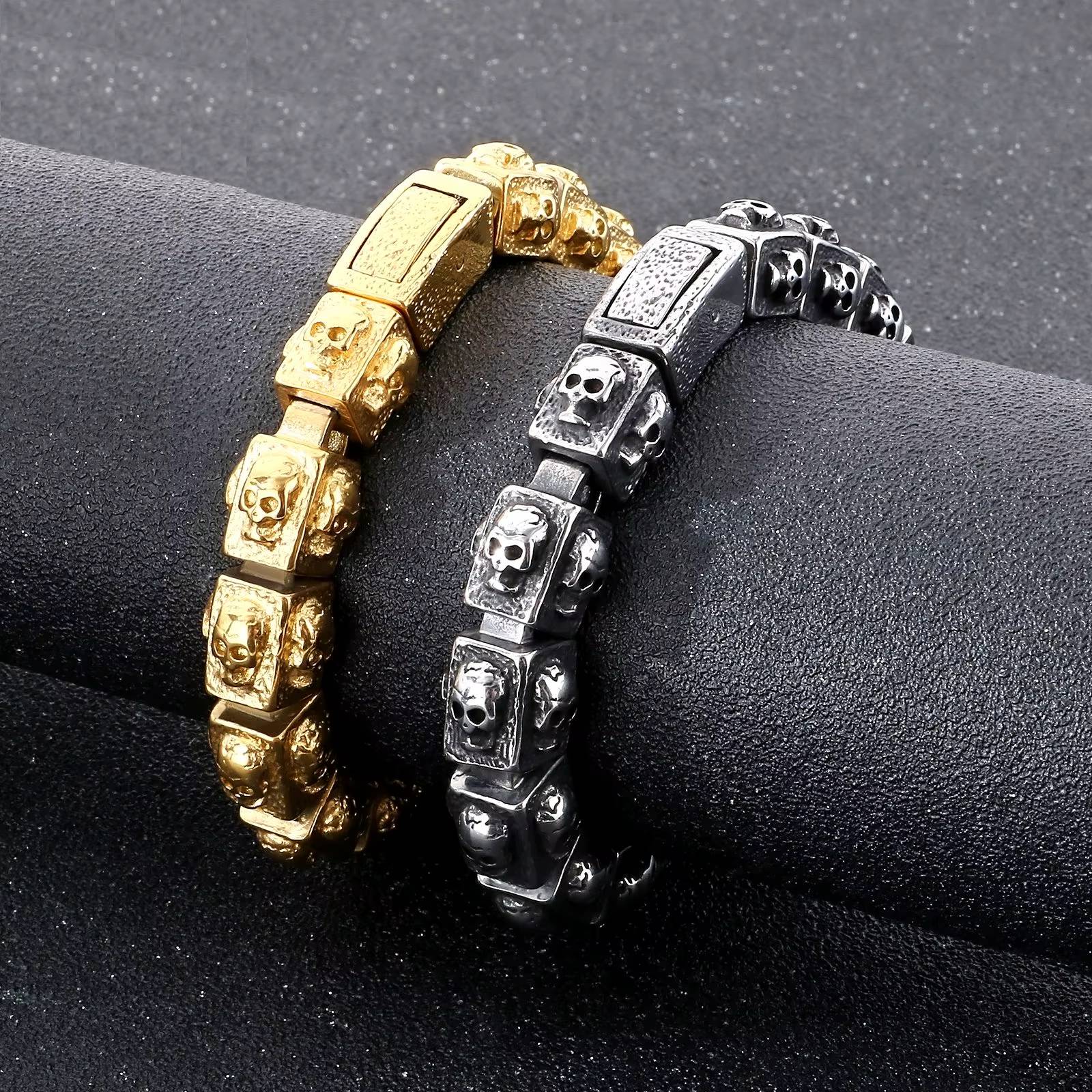 Heavy stainless steel skull bracelet in gold and silver finishes