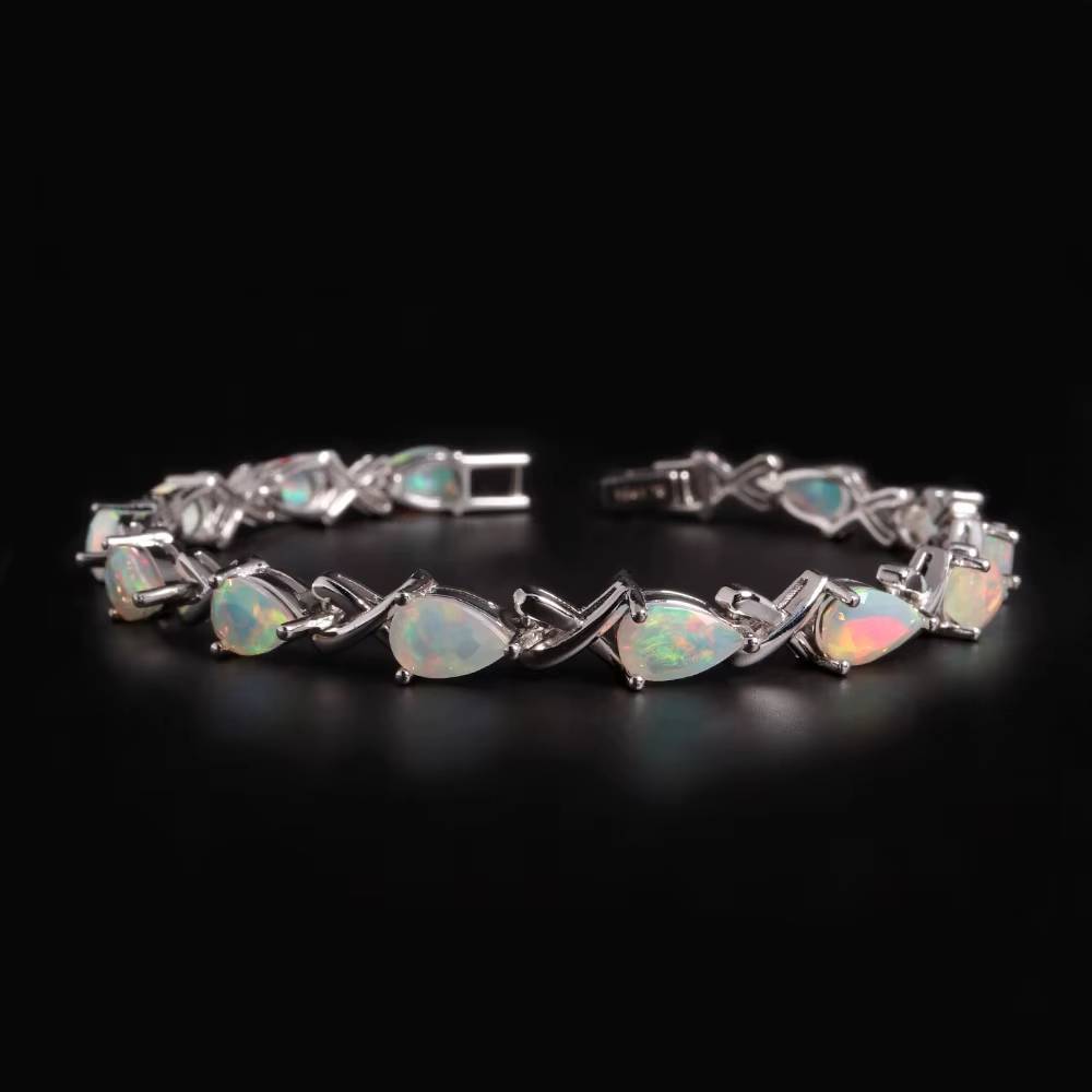 Close-up of opal bracelet glowing with rainbow hues