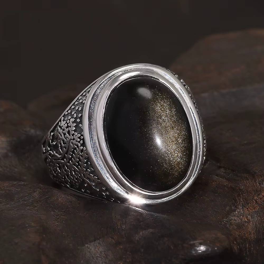 Silver ring with golden obsidian stone