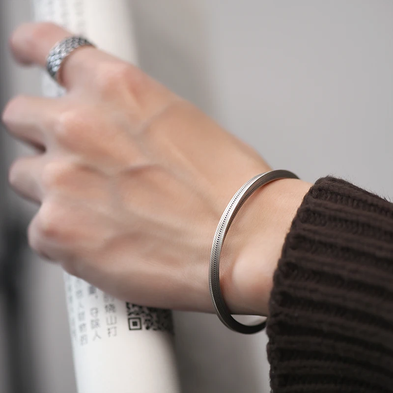 Silver Mobius Cuff Bracelet with Fish Bone Grain Design