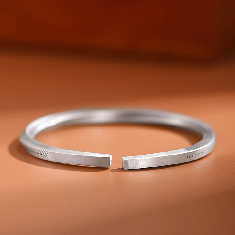 Silver Mobius Cuff Bracelet with Fish Bone Grain Design