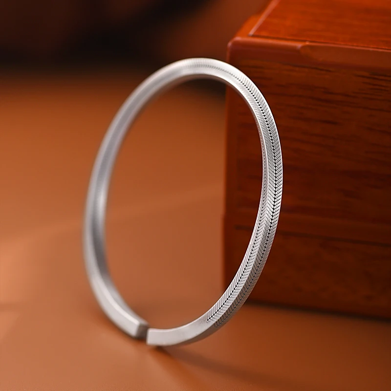 Silver Mobius Cuff Bracelet with Fish Bone Grain Design