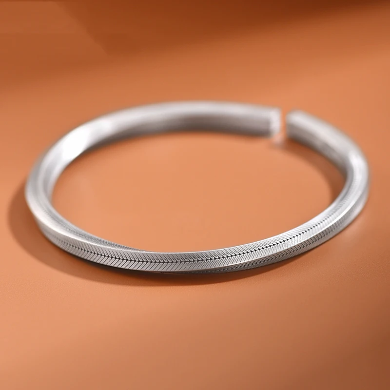 Silver Mobius Cuff Bracelet with Fish Bone Grain Design