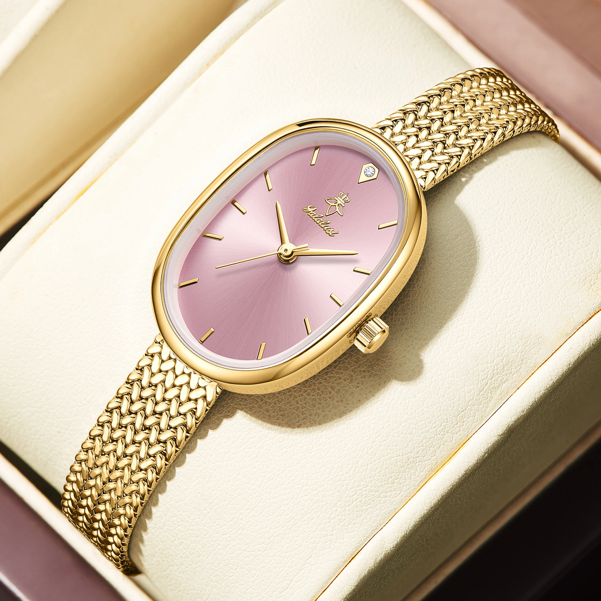Slim oval women’s quartz watch with pink dial and gold mesh strap