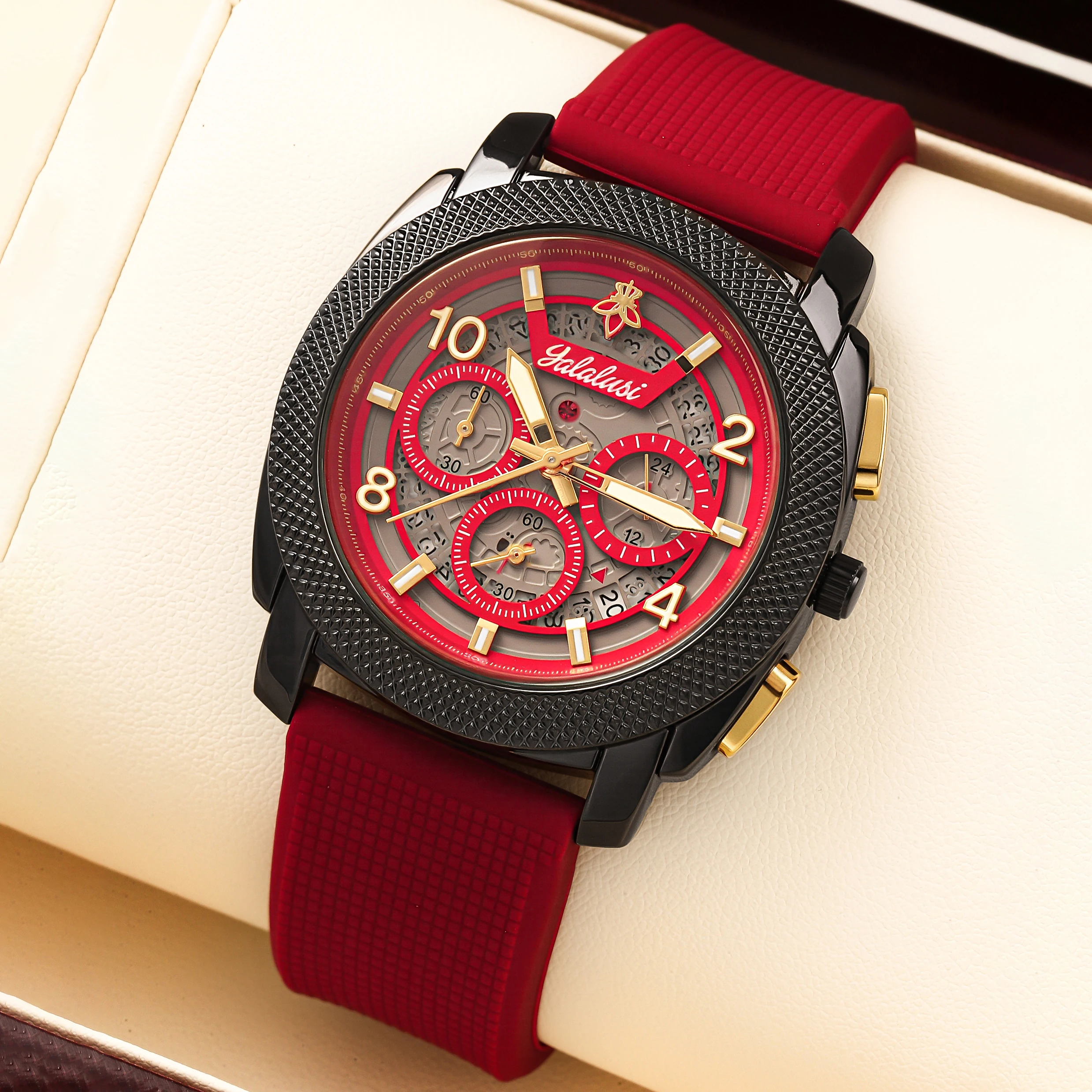 Red and black chronograph men’s watch with gold hands and silicone strap