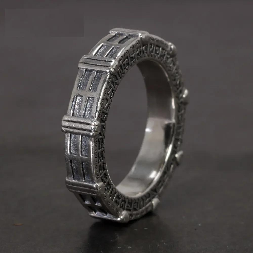 Stargate-inspired ring with glyph engravings in silver