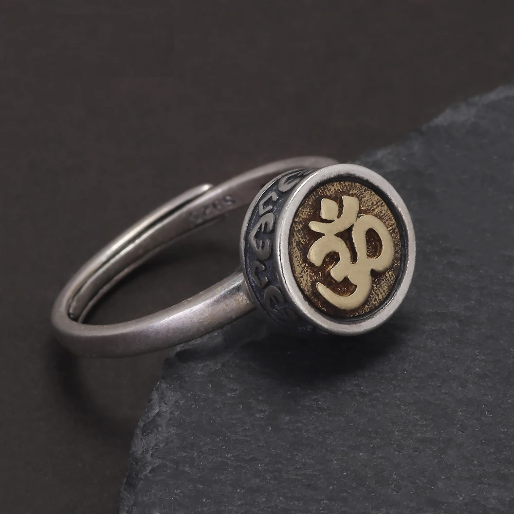 ilver rotating mantra ring with Om symbol, vintage finish