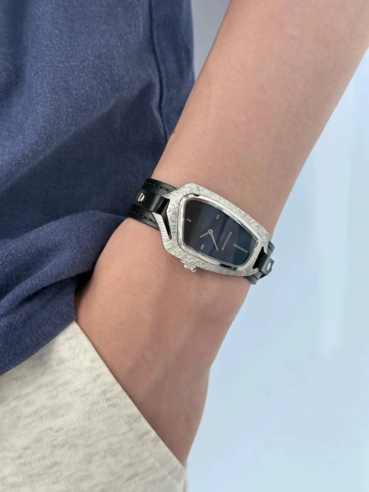 BENLYDESIGN M1 Sky & Freedom asymmetrical feather-inspired watch with black leather strap and Miyota quartz movement.