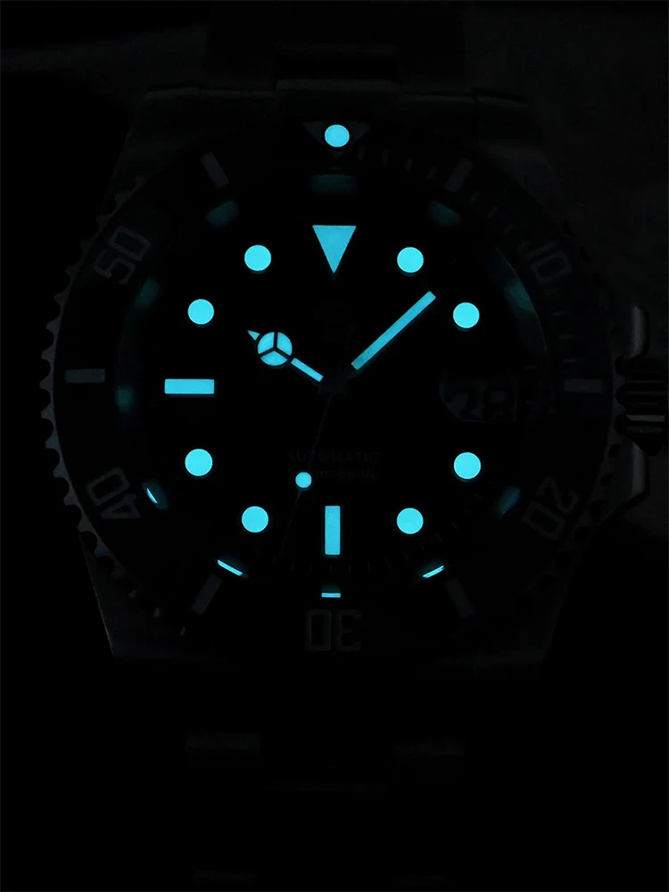 Glow-in-the-dark diving watch with luminous markers and hands for underwater visibility.