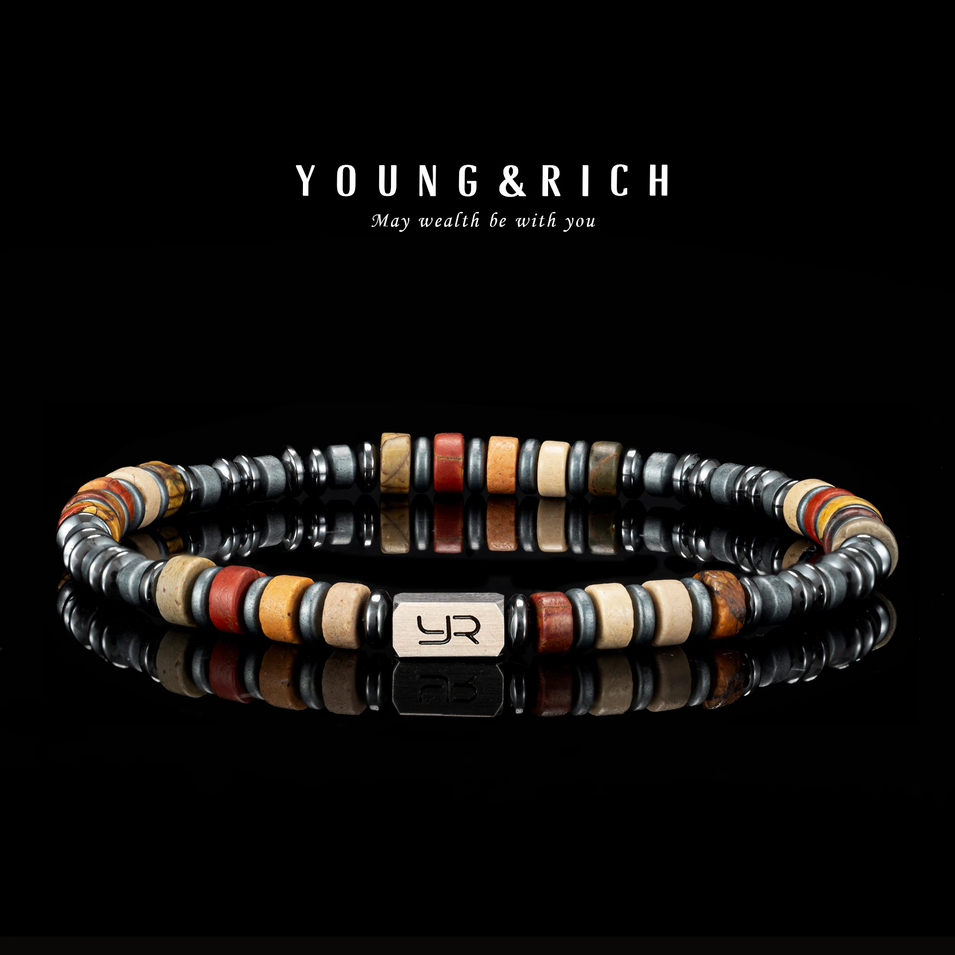 Close-up of alternating Picasso Jasper and Hematite beads