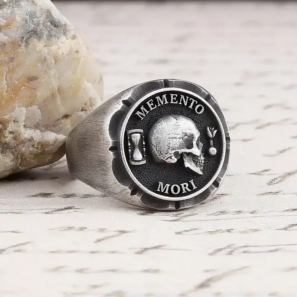 Sleek silver skull ring featuring 