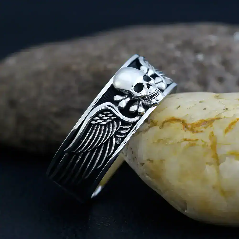 Men's silver skull with wings ring, gothic biker jewelry, stainless steel fashion accessory.