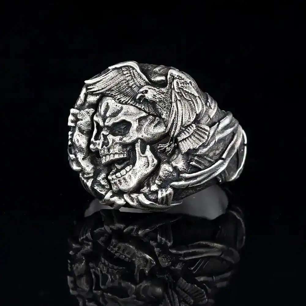 Bold silver skull ring with eagle detail, gothic men's jewelry accessory.