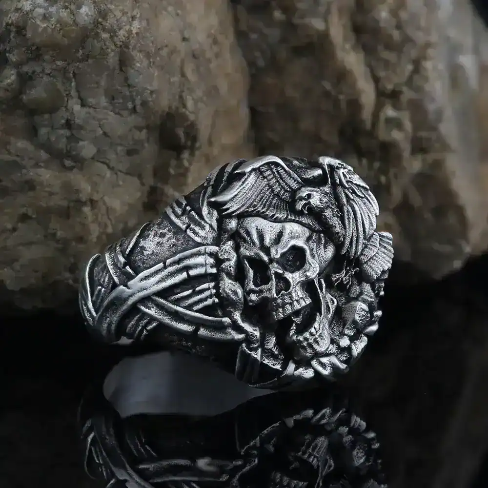Silver gothic skull ring featuring intricate wings and barbed accents for a rugged, statement jewelry look.