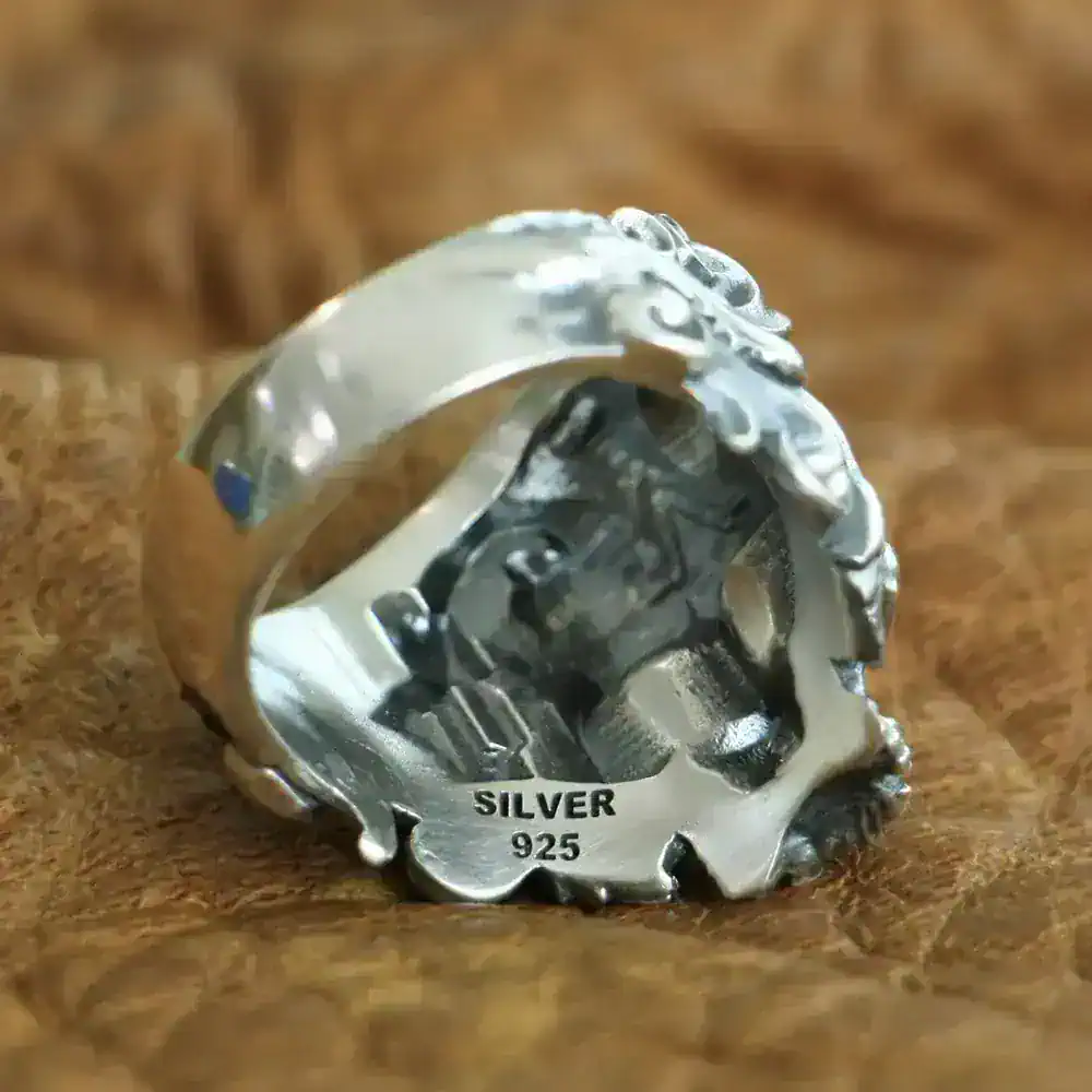 Sterling silver skull ring with detailed design, perfect for statement jewelry lovers.
