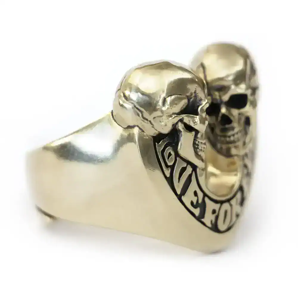 Sterling silver skull ring with black engraved details, bold statement accessory.