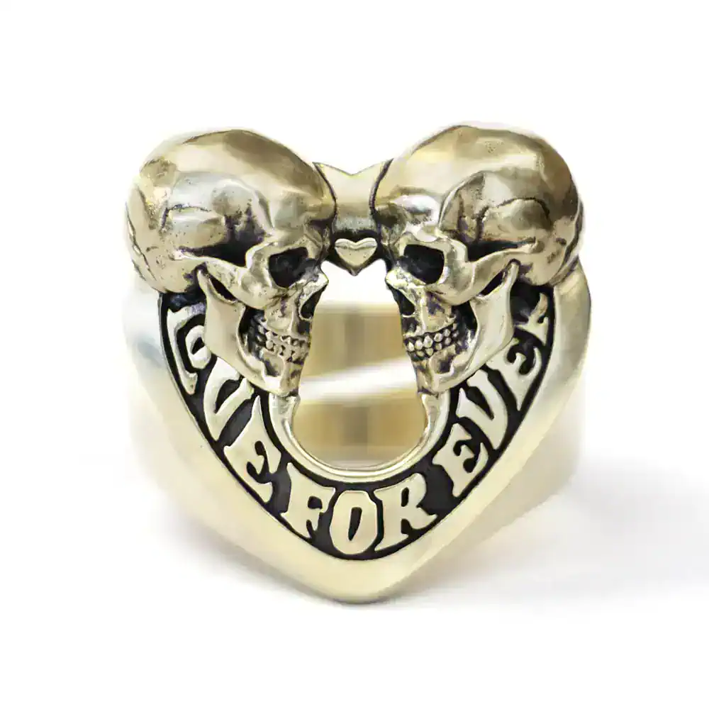 Intricate skull and heart ring with Gothic design, crafted in high-quality metal. Perfect for edgy fashion statements.