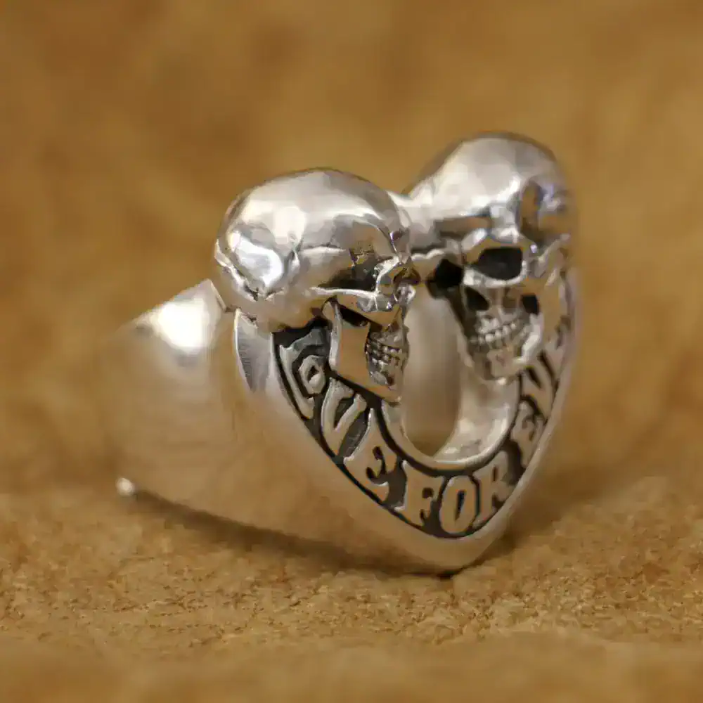 Silver skull and heart stainless steel ring.