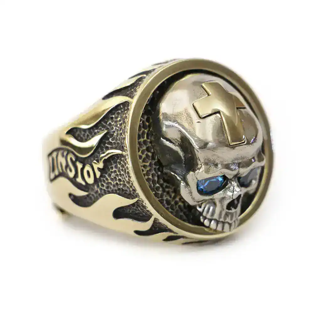 Bold biker skull and cross design, with flame accents, crafted in durable metal.