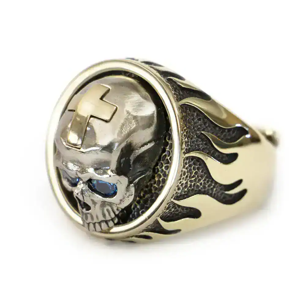 Men's punk skull ring featuring a detailed silver skull with a cross on the forehead and black flame accents on the band.