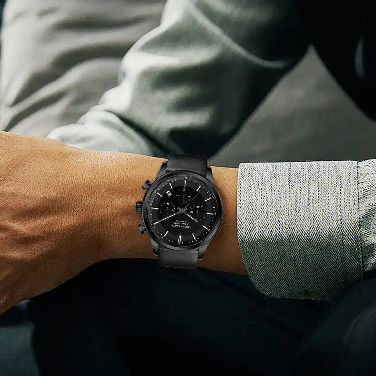 Men's black chronograph watch with leather strap, stylish and versatile accessory.
