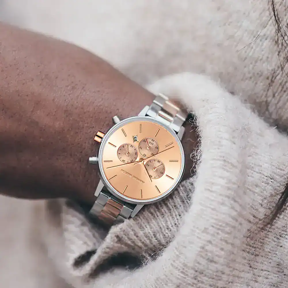 Stylish women's wristwatch featuring a rose gold dial, three sub-dials, and stainless steel band, perfect for luxury accessories.