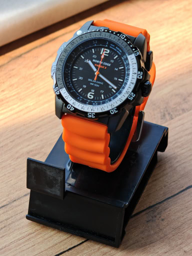 Durable North Edge EVOQUE 2 solar military watch with orange strap and rugged design.