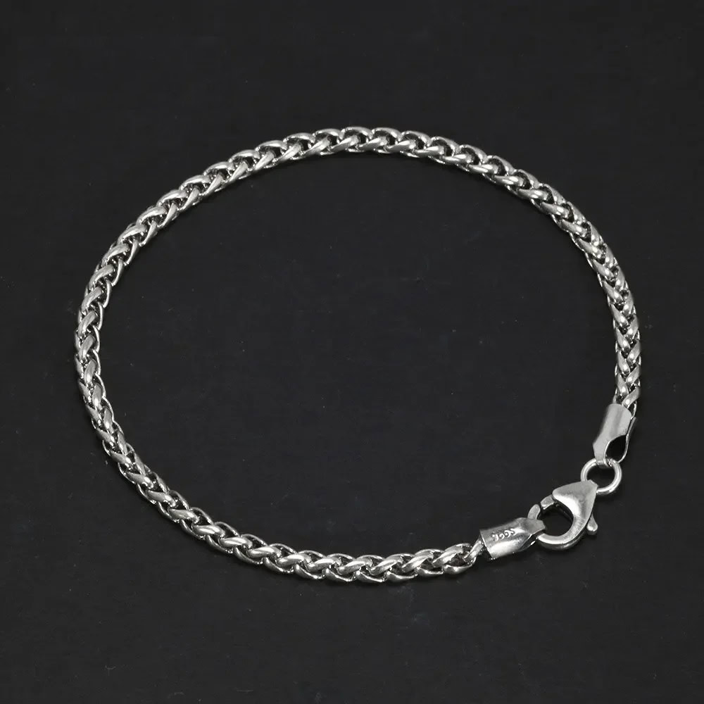 Stainless steel curb chain with lobster clasp, stylish jewelry accessory.