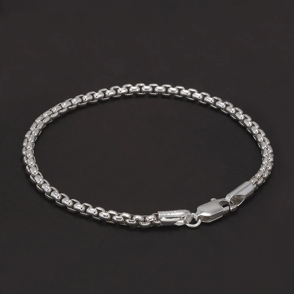 Silver chain bracelet featuring a classic link design and secure lobster clasp. Durable and stylish jewelry accessory.