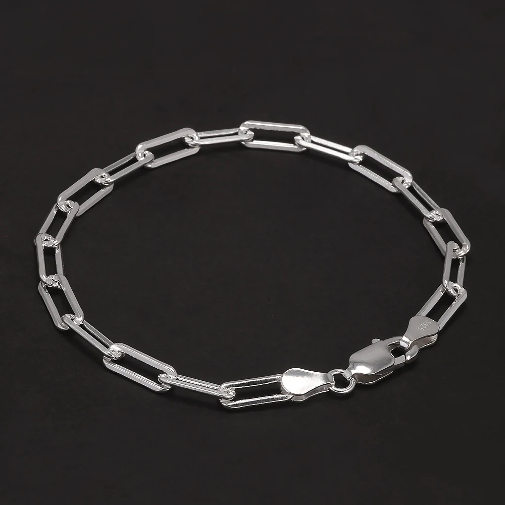 Stackable sterling silver chain bracelet with elongated links and secure lobster clasp.