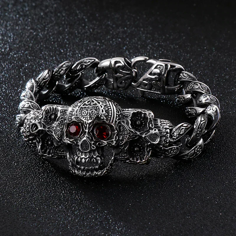 Men's gothic skull jewelry, stainless steel chain with detailed skull design and red gemstone eyes.