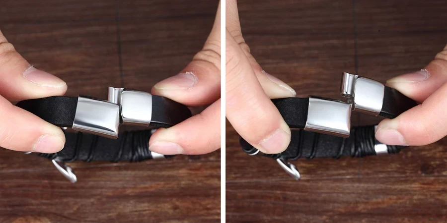 Versatile black leather bracelet with sleek silver clasp, perfect for stylish men's jewelry.