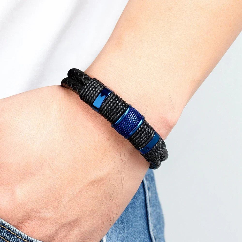 Stylish men's leather bracelet with blue metal accents and braided black leather design. Perfect for casual or edgy fashion.
