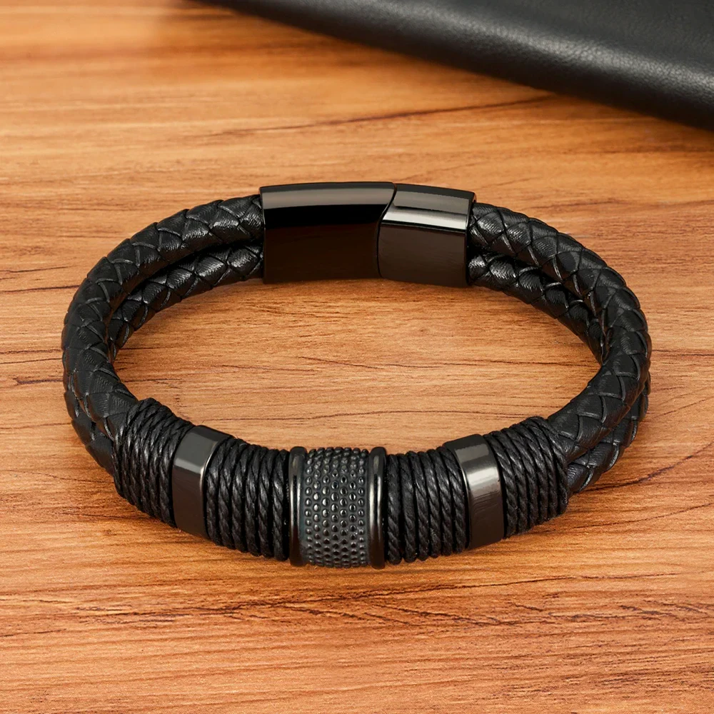 Men's black braided leather bracelet with stainless steel accents for a sleek look.