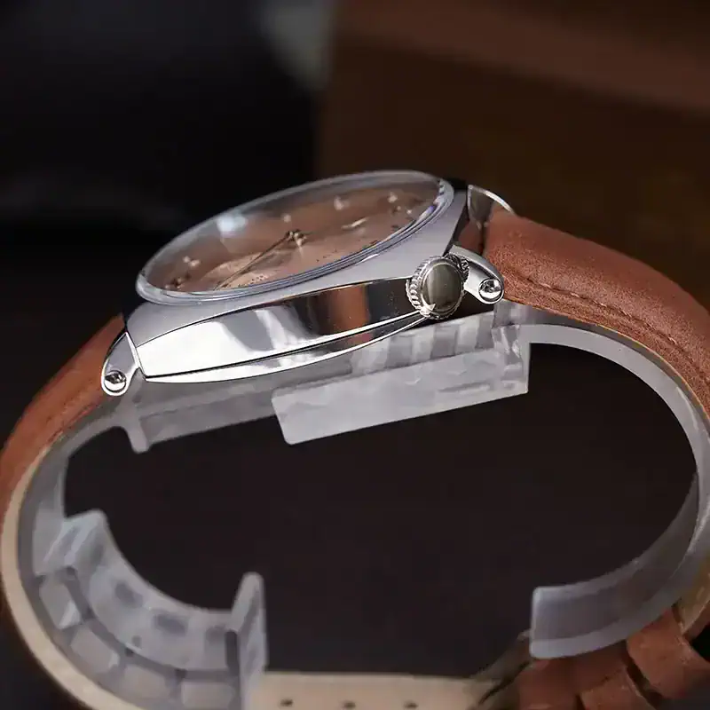 Luxurious stainless steel watch with brown leather strap, perfect for stylish occasions.