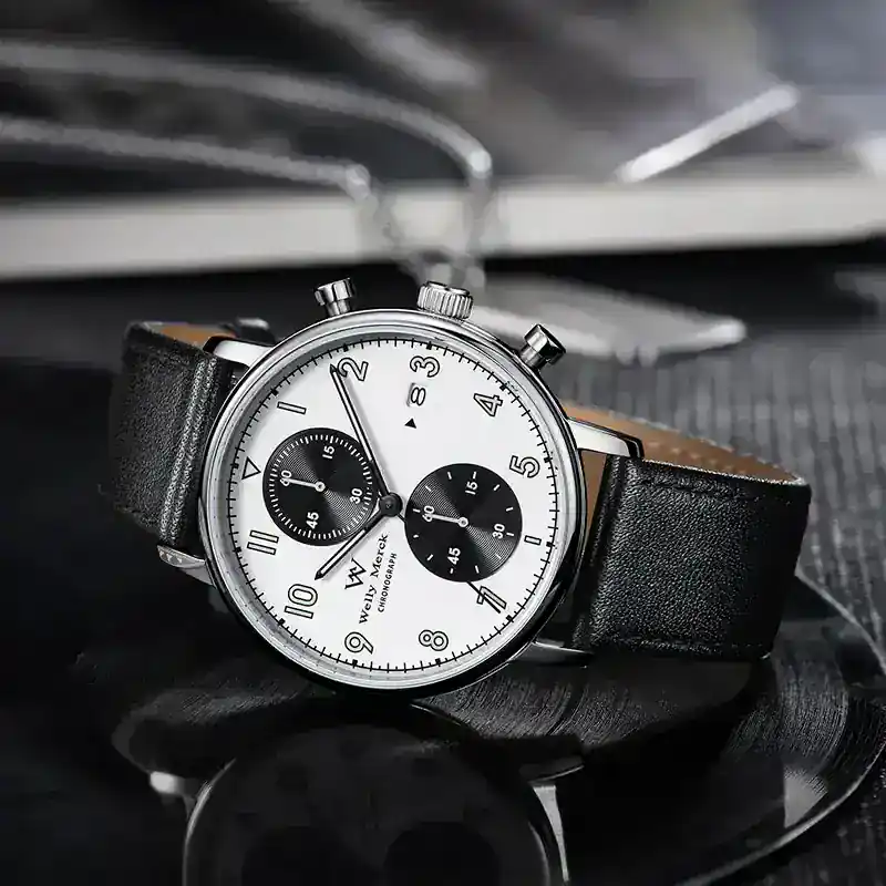 Stylish black dial chronograph watch featuring a leather band and stainless steel case, perfect for men's fashion.