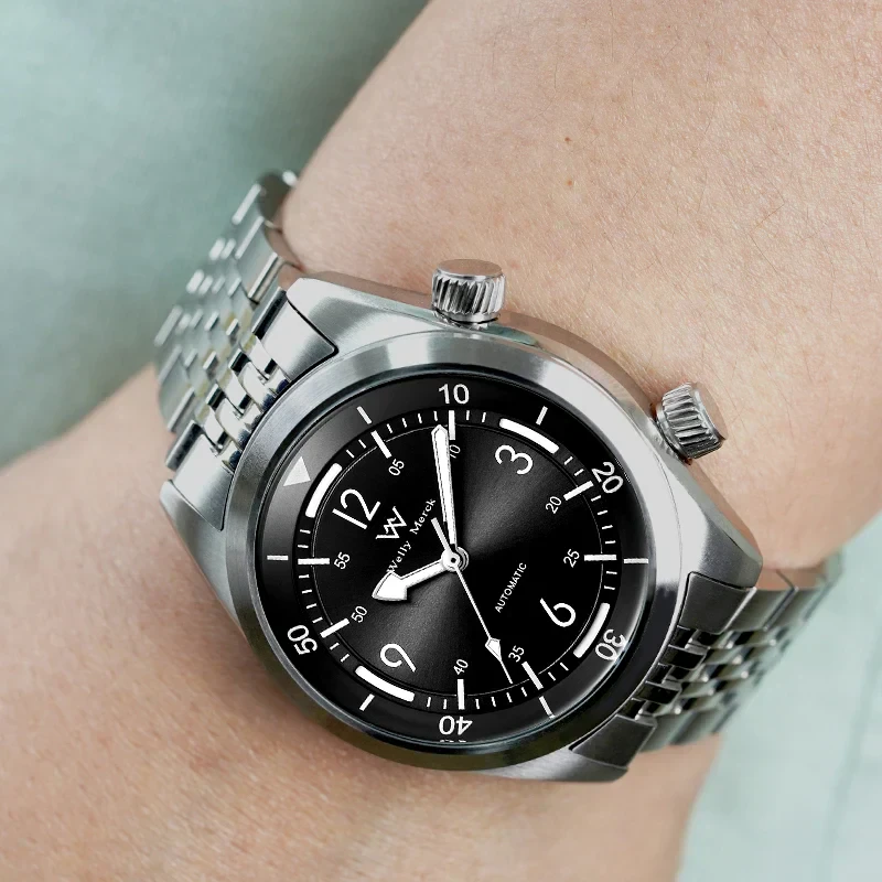 Stylish stainless steel wristwatch with black dial, automatic movement, and chronograph for men.