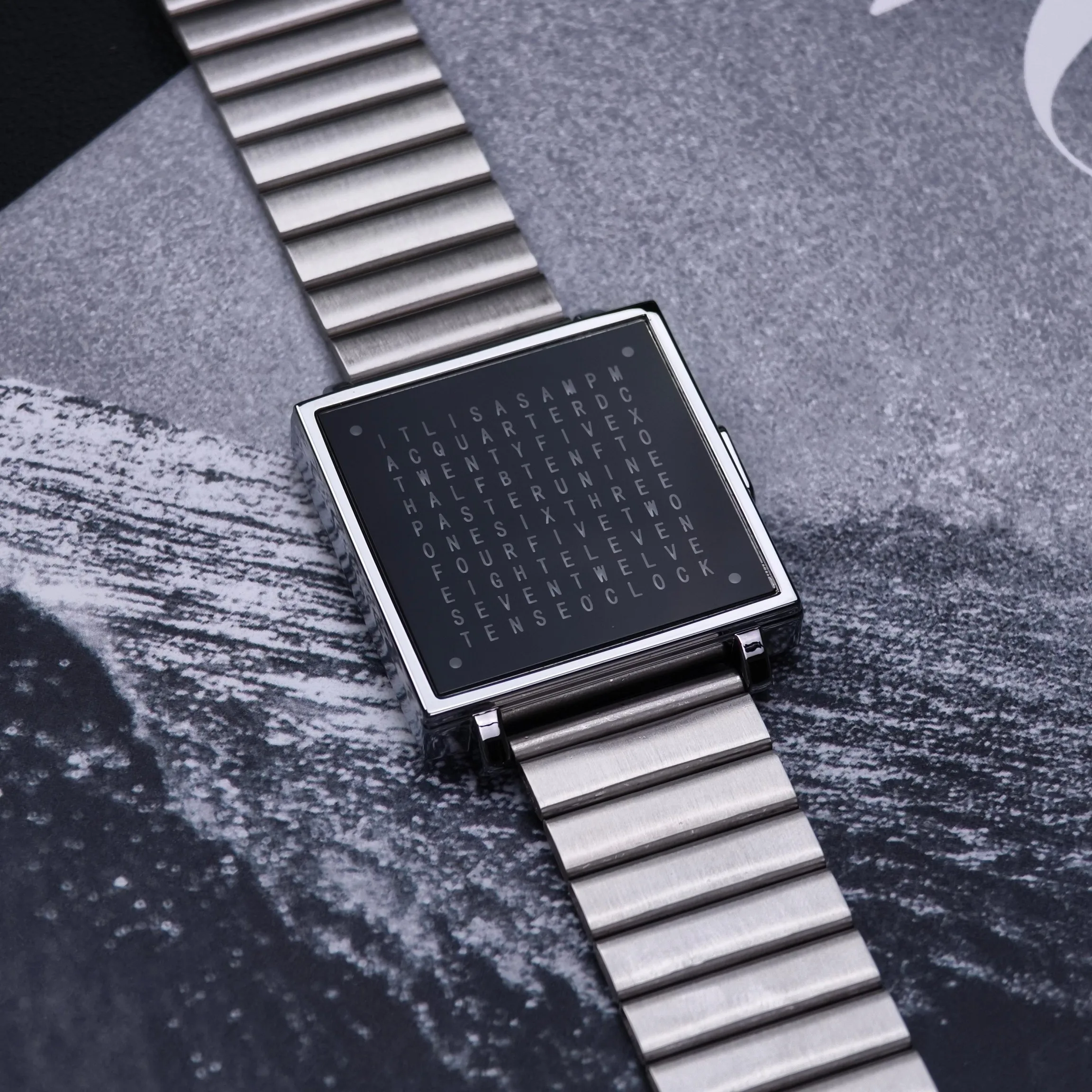 Luxury silver smartwatch with square face and metal band, perfect for modern jewelry enthusiasts.