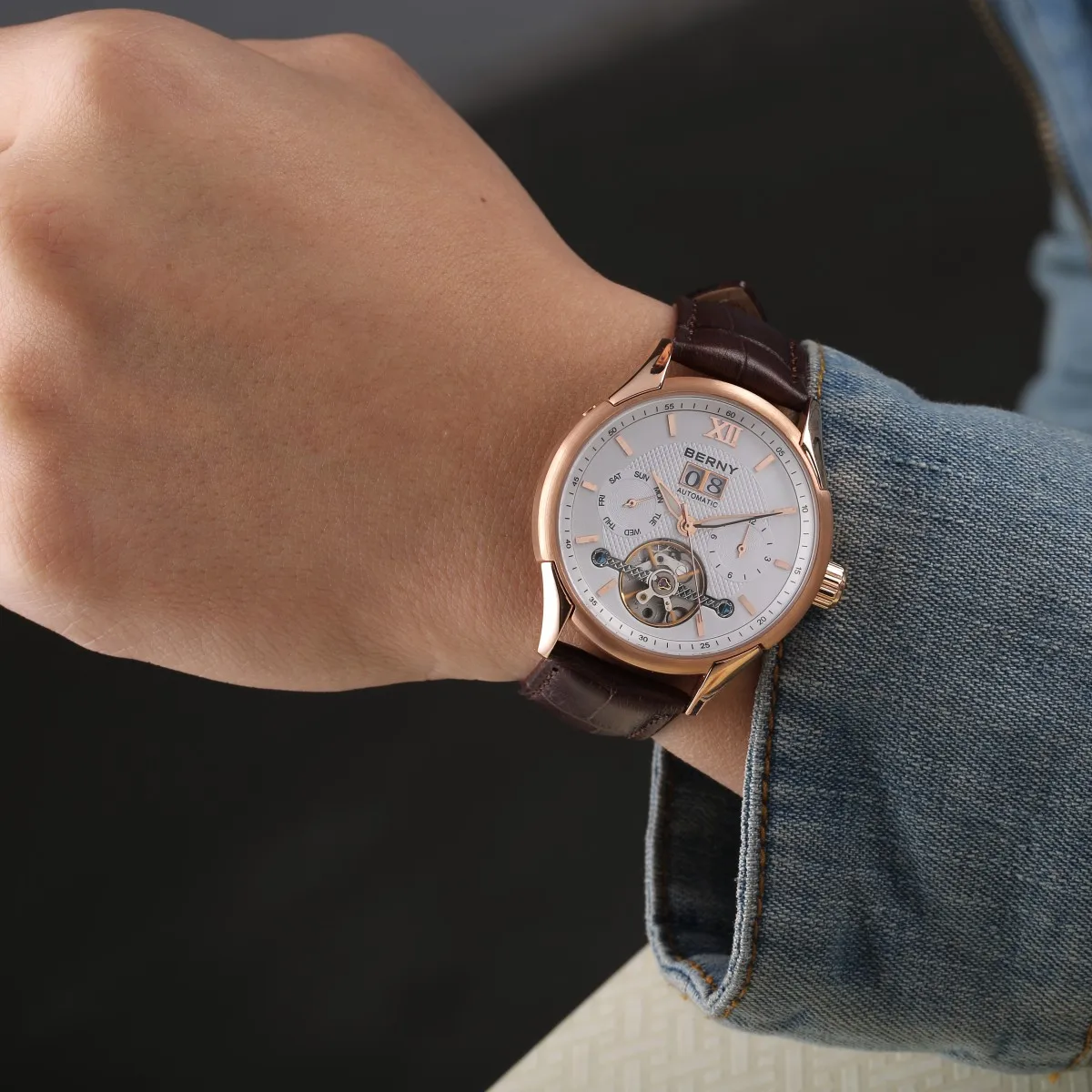 Elegant men's wristwatch featuring rose gold finish, automatic movement, and multi-function dials.