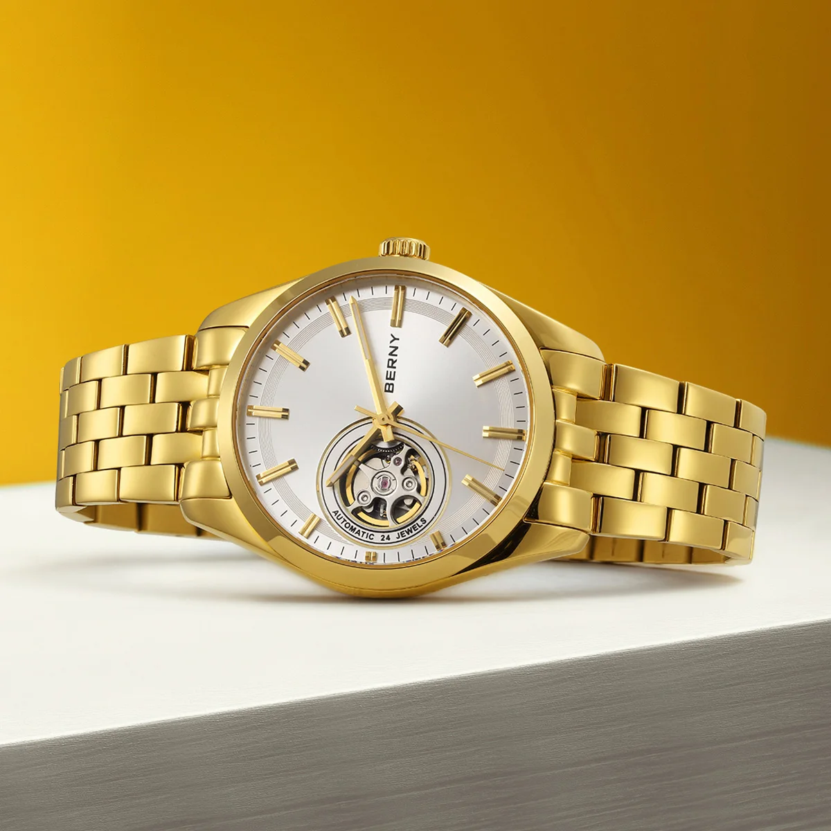 Elegant gold-tone men's watch featuring open-heart dial and stainless steel band.