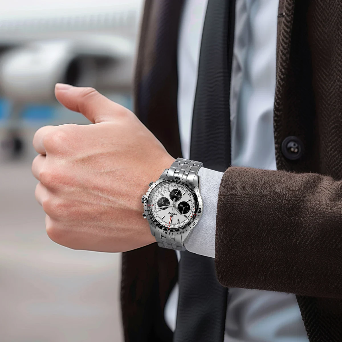 Stylish men's silver chronograph wristwatch with stainless steel band and detailed dial. Perfect for upscale fashion styles.