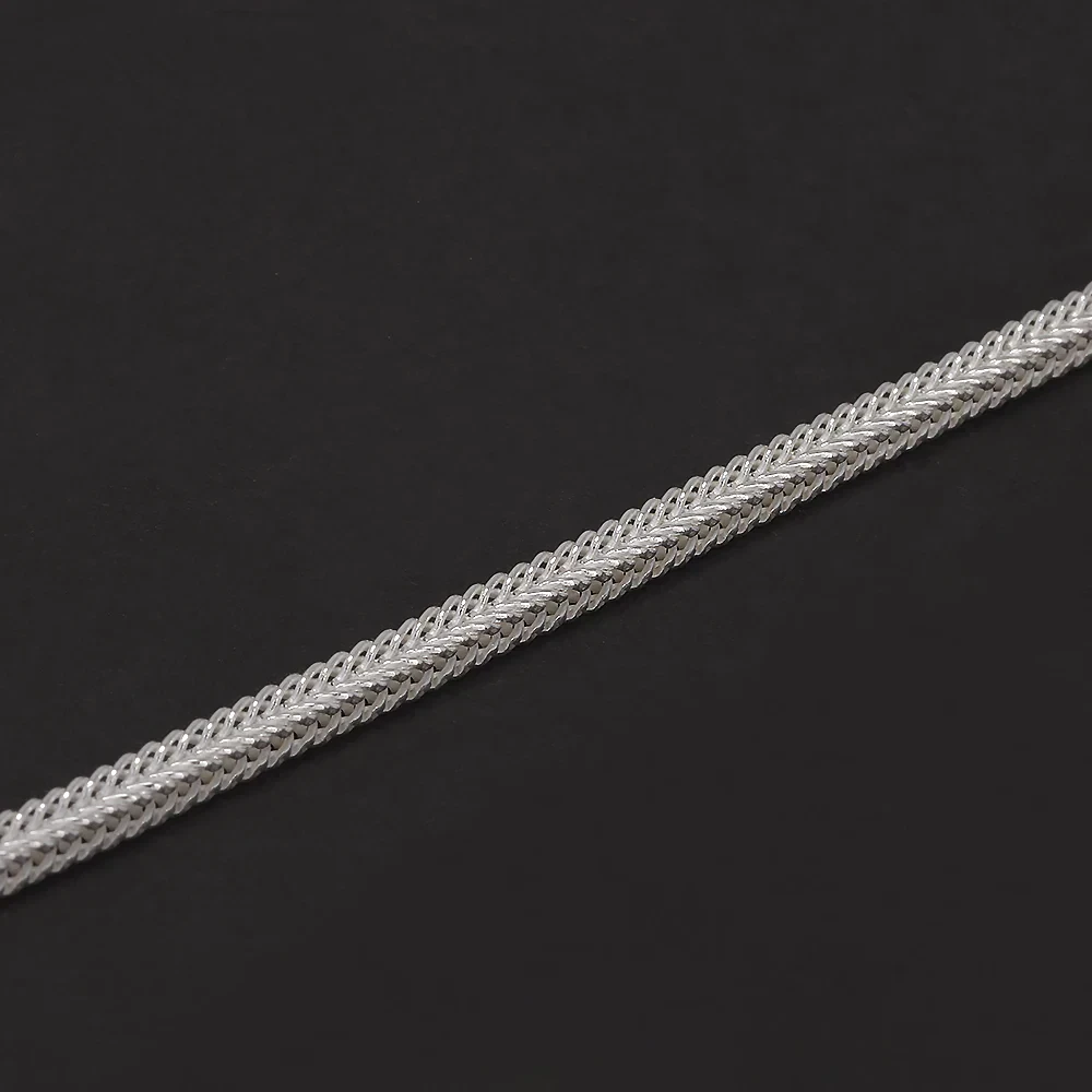 High-quality silver chain with intricate braided design, perfect for jewelry making or accessorizing.