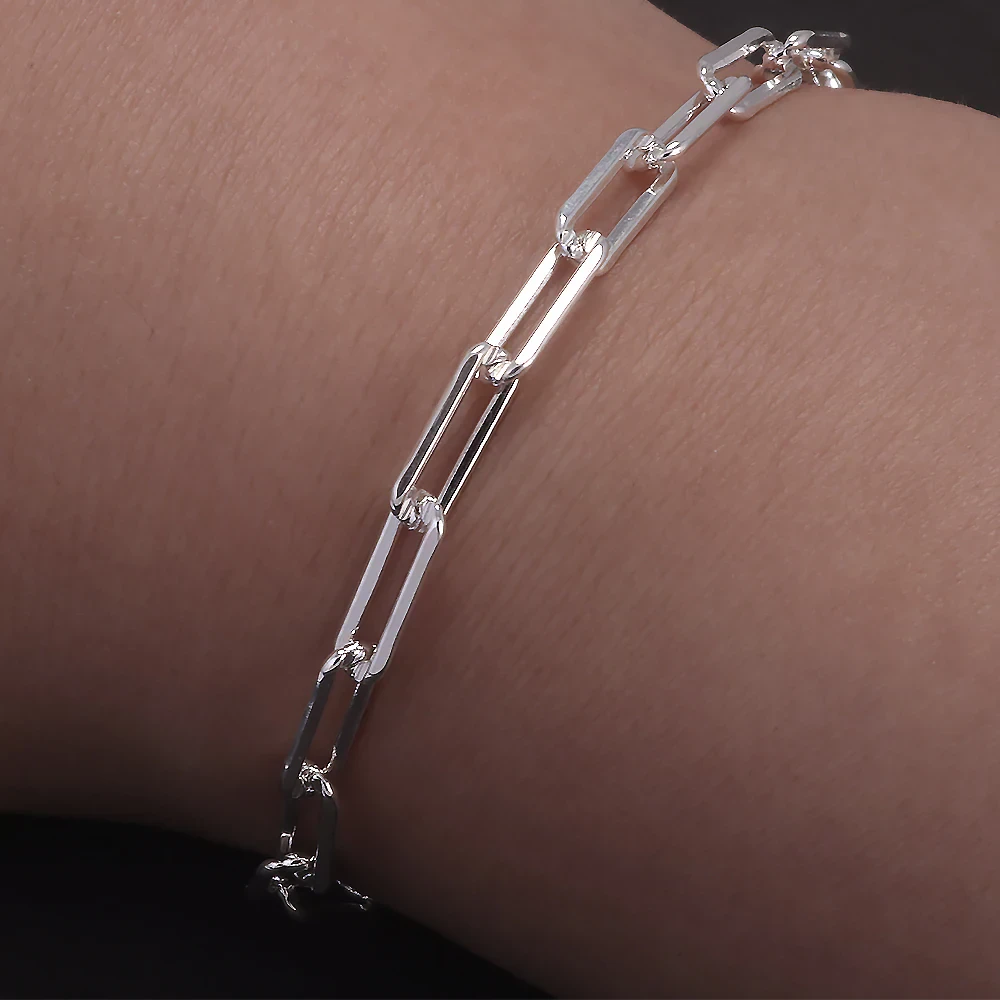 Delicate silver chain bracelet with rectangular links, perfect for casual or formal wear.