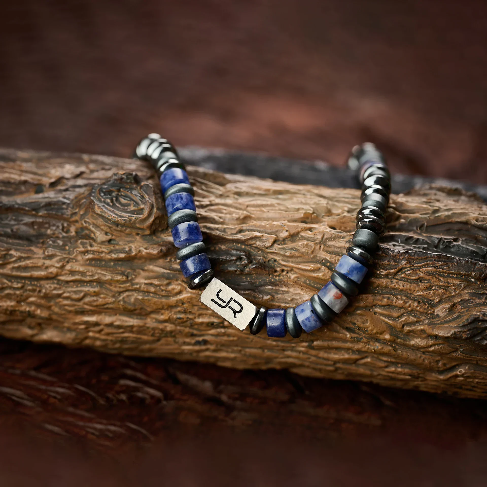 Men's beaded leather bracelet with initial charm, perfect for everyday accessory and gift.