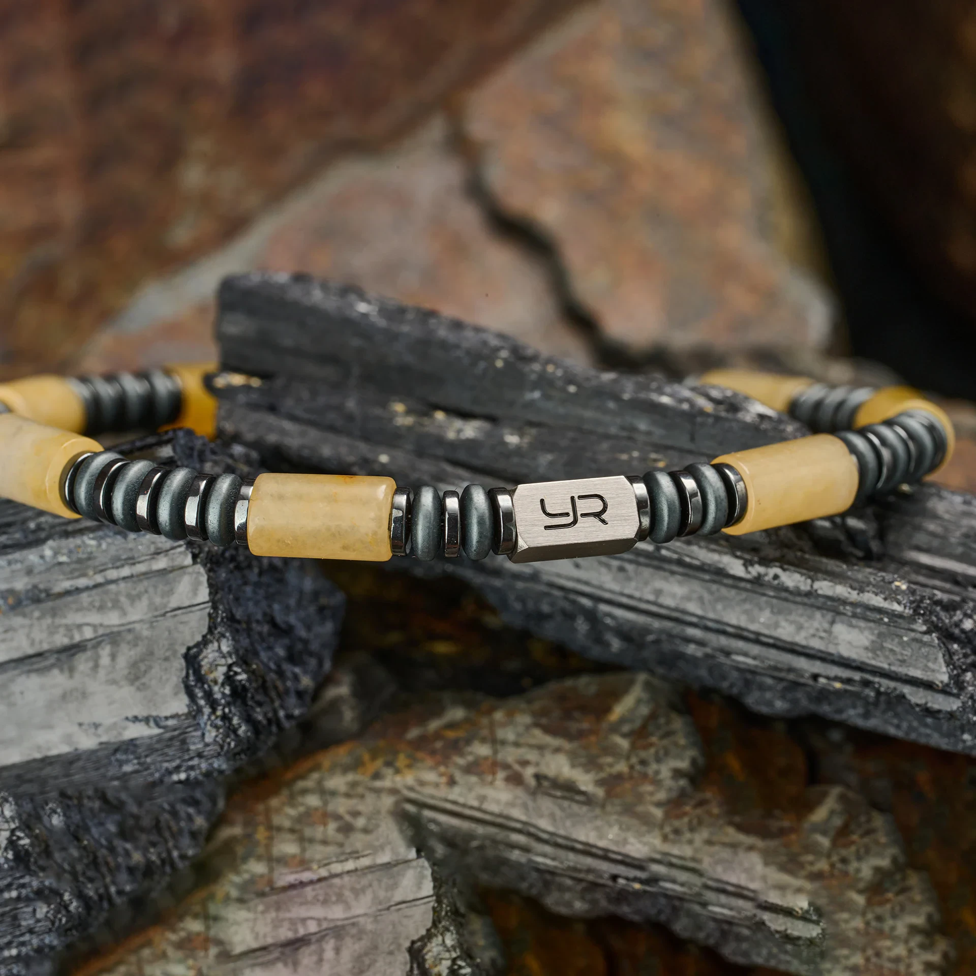 Stylish men's beaded bracelet with leather, metal, and wood accents for casual or formal wear.