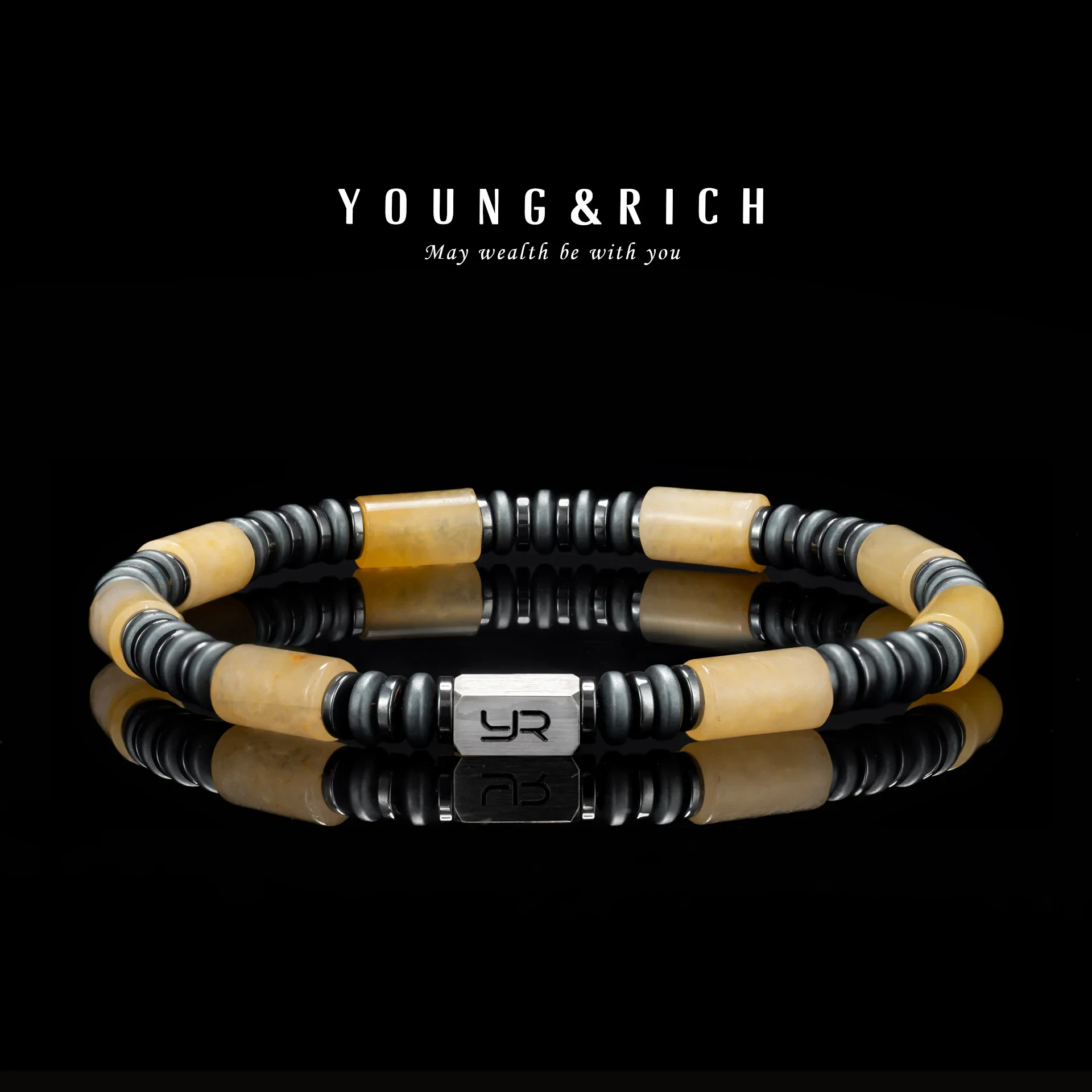 Stylish men's beaded bracelet with black, beige, and silver accents featuring JWLR added charm.