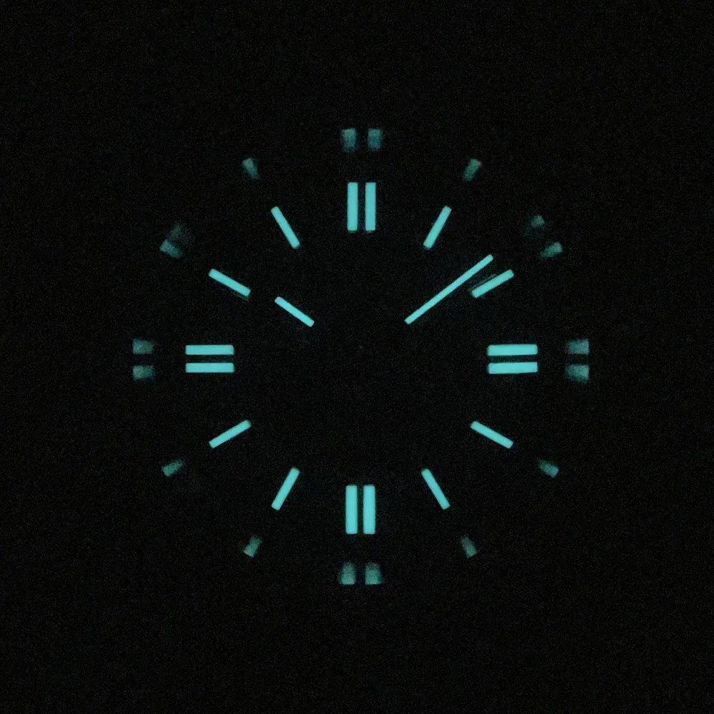 Glow-in-the-dark watch with luminous hands and markers.